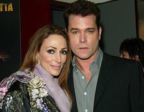 Michelle Messer and Ray Liotta taking a picture together.